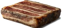 Smoked bacon slab with layers of meat and fat on dark background, raw pork belly cut showing marbled texture and cured meat structure.