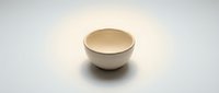 Empty ceramic bowl on white background isolated for kitchen design and culinary projects.