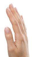 Female hand with natural almond-shaped nails featuring soft pink and white ombre manicure design. Isolated on white background for beauty, cosmetics, and nail care marketing materials.