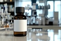 Brown glass bottle with blank white label on laboratory counter, blurred scientific equipment and glassware in background, medical research setting.
