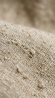 Natural burlap fabric texture with organic hemp fibers and rustic weave pattern for eco-friendly packaging and sustainable craft projects.