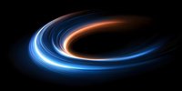 Glowing blue and orange light trails swirling in spiral motion against black background create dynamic energy effect for technology and space designs.
