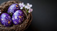 Purple decorated Easter eggs with delicate star patterns nestled in natural woven nest with spring blossoms against dark background, creating festive holiday mood.