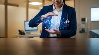 Professional businesswoman in dark suit presenting holographic digital globe with network connections in modern office environment for technology presentations.
