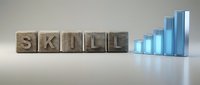 Wooden letter blocks spelling SKILL next to ascending blue glass bars representing growth and development in professional competencies and abilities.