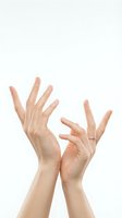 Two elegant female hands with manicured nails gesturing gracefully on white background, isolated for skincare and beauty product advertising campaigns.