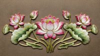 Elegant pink lotus flowers with green leaves embroidered on beige fabric background. Traditional floral needlework design for textile decoration and crafts.