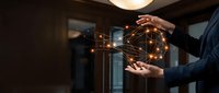 Hands of two professionals exchanging glowing network connections symbolizing digital collaboration, data transfer, and business partnership in modern office environment.