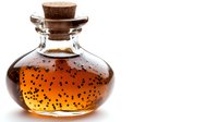 Glass bottle with amber liquid and black seeds sealed with cork stopper on white background, isolated for product design.