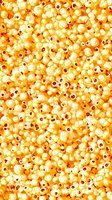 Fresh popcorn kernels background with crispy yellow and white pieces scattered in seamless pattern for food packaging and cinema designs.