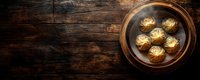 Asian dumplings dim sum in traditional bamboo steamer on dark rustic wooden background with copy space, top view panoramic banner format.