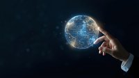 Hand holding glowing digital globe with network connections and data visualization on dark background for global technology and business concepts.