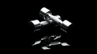 Pair of chrome dumbbells with reflective surfaces on black background, isolated for fitness and gym design projects.