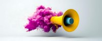 Yellow megaphone emitting vibrant pink smoke cloud against light background, representing communication impact and creative message broadcasting.
