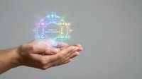 Cupped hands presenting holographic recycling symbol with glowing arrows and sustainability icons floating above palms on neutral background.