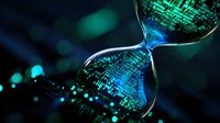 Digital hourglass with flowing binary code and glowing blue-green particles against dark background shows concept of time in modern technology era.