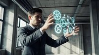 Professional businessman interacting with holographic gear interface displaying digital technology and innovation concepts in modern office environment.