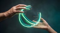 Hands holding glowing neon green tube light against dark background, representing technology, energy, and innovation for digital design projects.