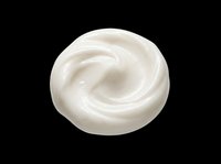 White cream swirl smear isolated on transparent background, ready for beauty, skincare, and cosmetic design use in stickers, clipart, and print on demand projects.