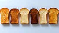 Six different bread slices arranged in row showing variety of textures and colors from white to dark rye perfect for bakery menu design concepts.