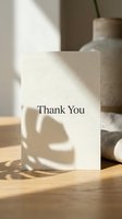 Elegant thank you card with monstera leaf shadow on wooden table, neutral tones, soft natural light, minimalist style for greeting design.
