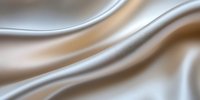Elegant flowing waves of silver and beige satin fabric create smooth undulating curves and luxurious folds in soft neutral tones, suitable for luxury backgrounds.