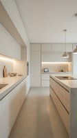 Modern minimalist kitchen interior with white cabinets, LED lighting, and clean lines for contemporary home design and architecture projects.