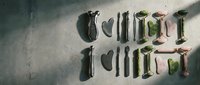 Gothic calligraphy letters spelling words on textured stone surface with dramatic lighting and shadow effects for medieval design projects.