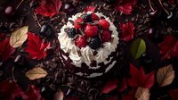 Chocolate cake decorated with fresh berries and whipped cream, surrounded by red autumn maple leaves and dark moody background for food photography.