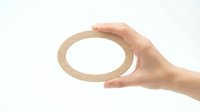 Hand holding wooden ring circle on white background isolated for design projects and presentations.