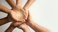 Diverse group of hands stacked together in circle showing unity, teamwork, and collaboration. Concept for business team building, community support, and cooperative partnership.
