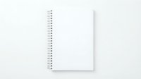 Blank white spiral notebook with clean pages open on light background for writing notes and creative projects.