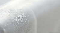 White sparkling glitter sphere with soft bokeh background creates elegant festive atmosphere for holiday decorations and luxury design projects.