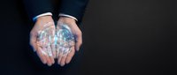 Business professional holding glowing digital brain with network connections representing artificial intelligence and innovation in corporate technology solutions.