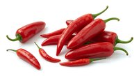 Fresh red chili peppers isolated on white background for cooking, spice ingredients and culinary design projects.