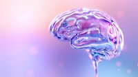 Translucent glass brain model with pink and purple gradient background illuminated by soft bokeh lights, showcasing medical science and neurology concepts.