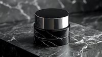 Luxurious black marble cosmetic jar with metallic silver lid on dark marble surface, elegant packaging mockup for premium skincare and beauty products.