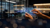 Hands interacting with futuristic holographic interface displaying data analytics and digital charts in modern office environment for business technology.