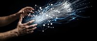 Two male hands releasing digital data streams and network connections against black background, representing technology innovation and data transfer.
