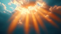Dramatic sunbeams breaking through clouds in turquoise sky, creating ethereal golden rays and atmospheric light effect. Spiritual and inspirational background.