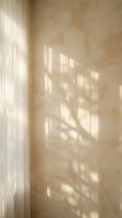 Warm sunlight streaming through sheer curtains creating soft shadows on textured wall in minimalist interior space for home decor and wellness concepts.