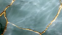 Elegant sage green marble texture with luxurious gold veining creates sophisticated natural stone pattern for interior design and decorative applications.