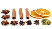 Aromatic spices and dried orange slices arranged on white background. Star anise, cinnamon sticks, cloves, cardamom pods for cooking and baking recipes.
