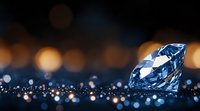 Sparkling blue diamond on dark surface with glittering bokeh lights in background creating luxurious atmosphere and magical reflections.