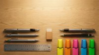 Office supplies and stationery items arranged on wooden desk surface including pens, ruler, sticky notes and colorful highlighter markers for workspace organization.