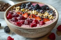 Healthy breakfast smoothie bowl with fresh berries, granola and chocolate chips served in ceramic bowl, perfect for social media, food blog or menu design.