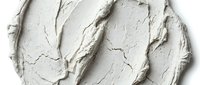 Thick white cream or paste with textured brushstrokes and organic patterns, suitable for cosmetics, skincare, beauty product packaging, and design backgrounds.