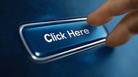 Finger pressing glossy blue button with click here text on dark background, modern web design element for digital marketing and call to action purposes.