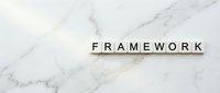 Wooden letter tiles spelling FRAMEWORK on elegant white marble surface for business strategy and organizational structure concepts.