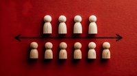 Wooden figurines arranged in two rows on vibrant red background with horizontal arrow, representing team structure, social distancing, or organizational hierarchy.